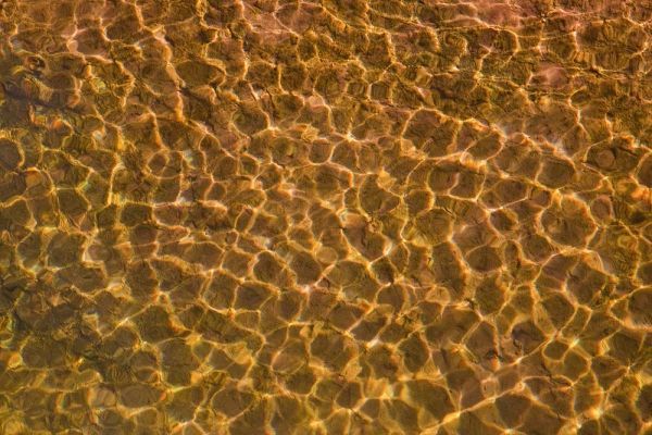 UT, Glen Canyon Sunlight in shallow water